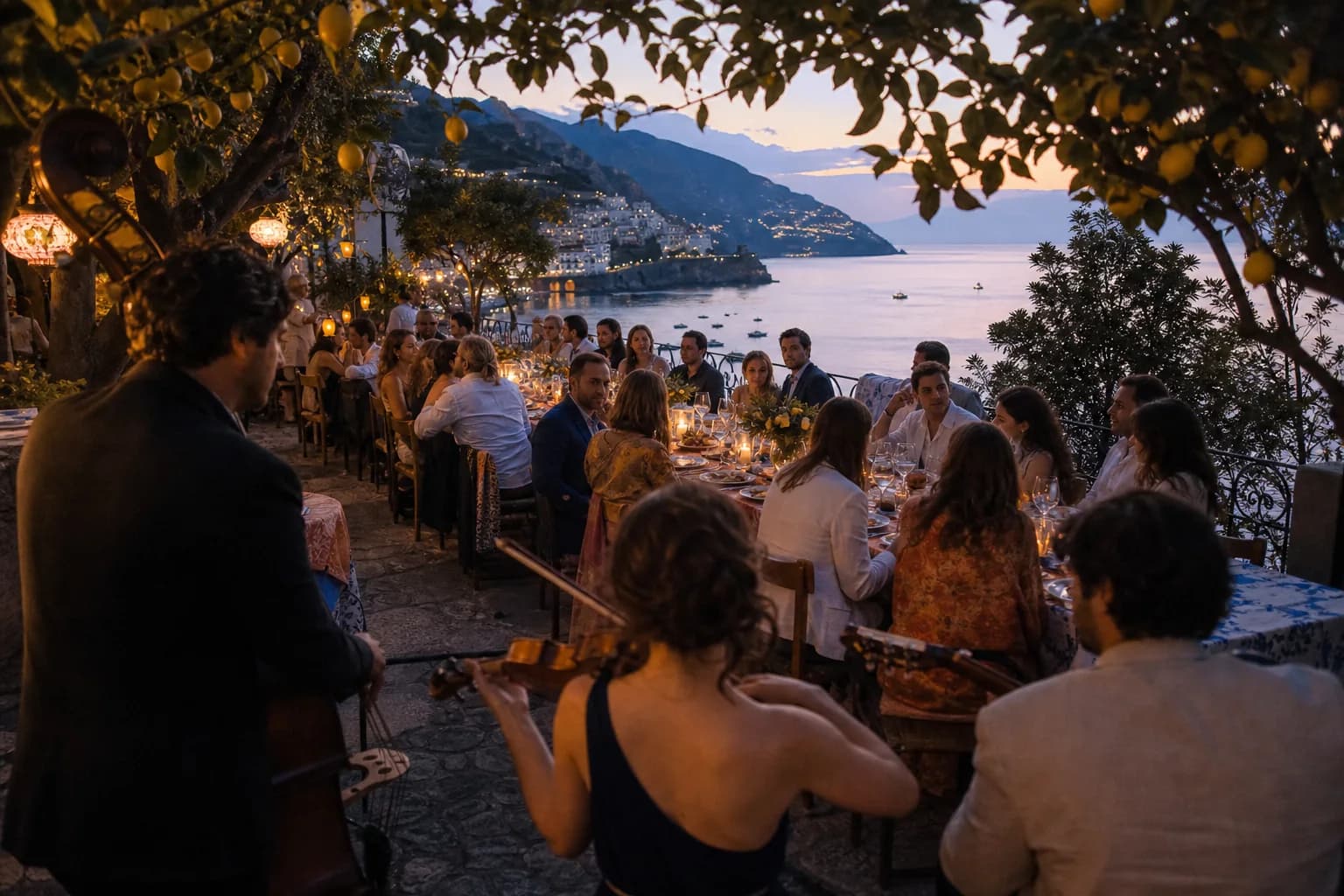 Guests dining above the Amalfi coast while an acoustic trio performs