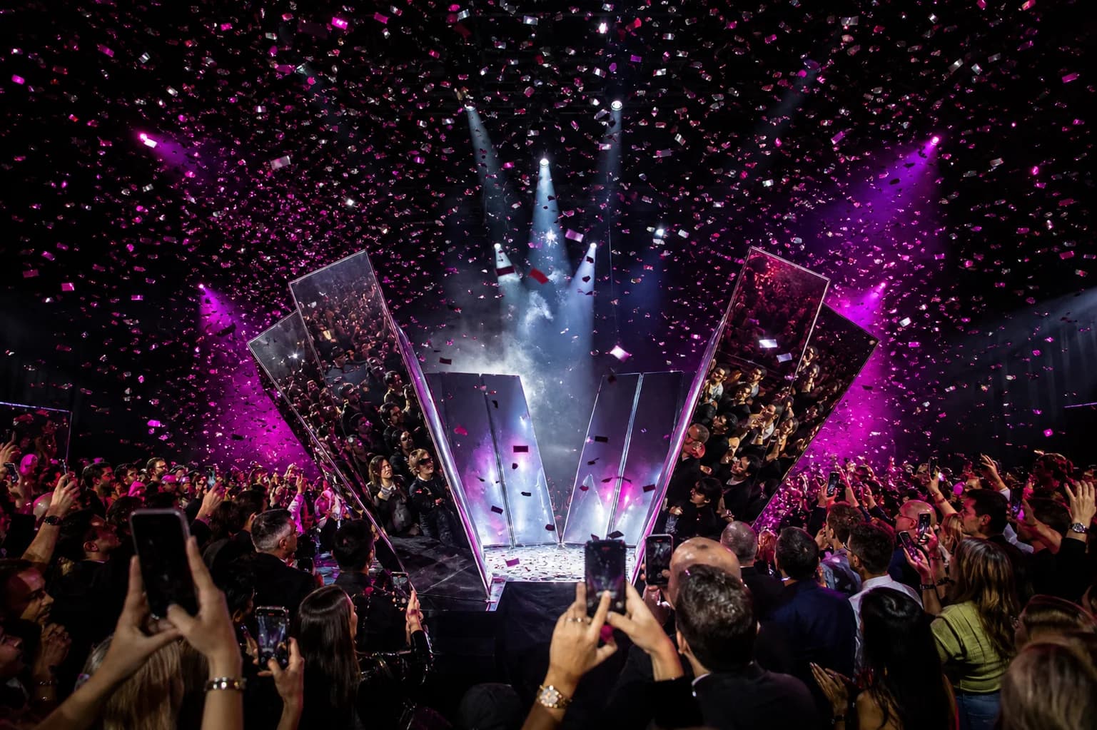 Immersive corporate launch with stage lighting and a crowd