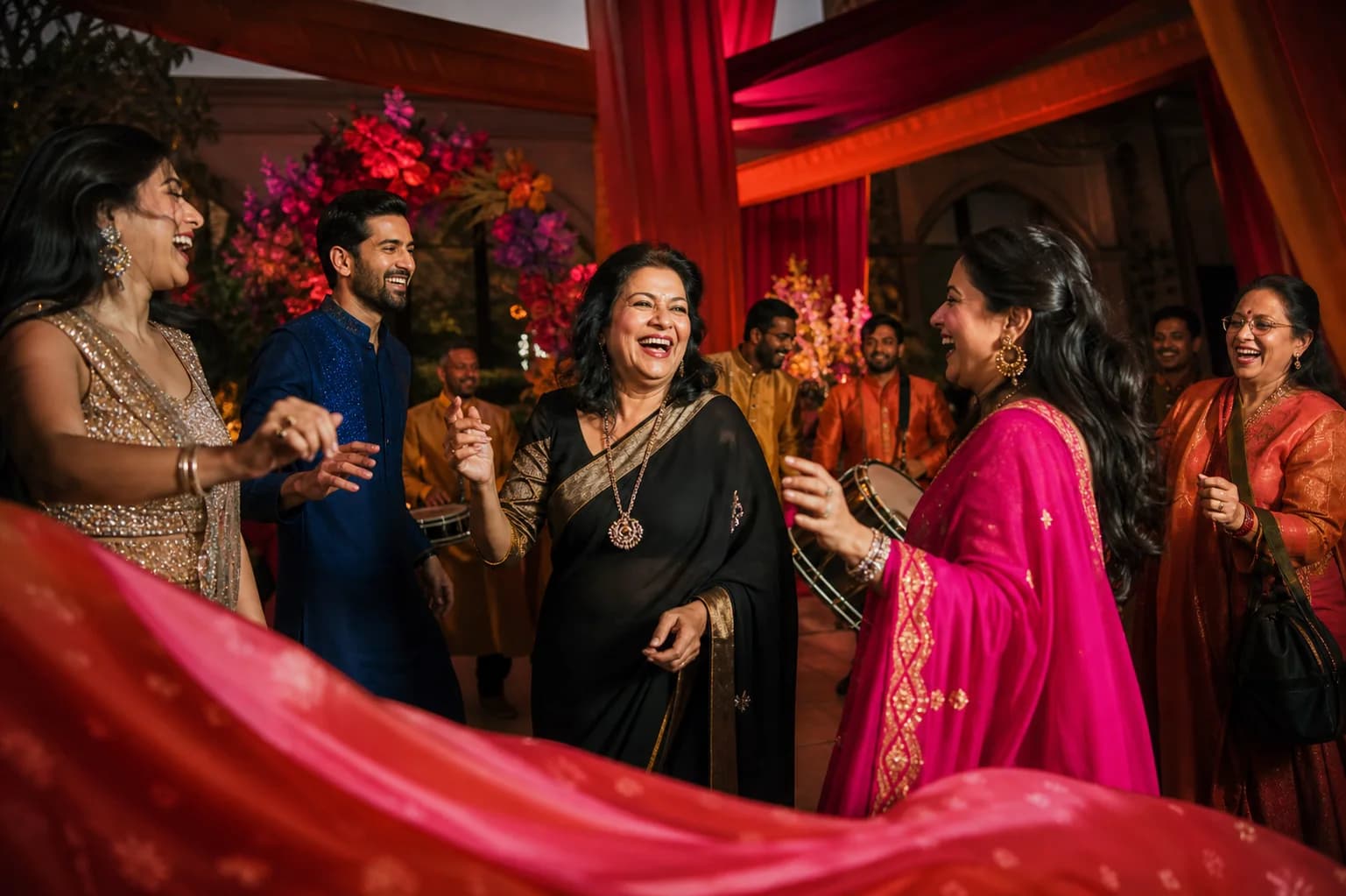 Family and friends dancing at a joyful, colourful celebration